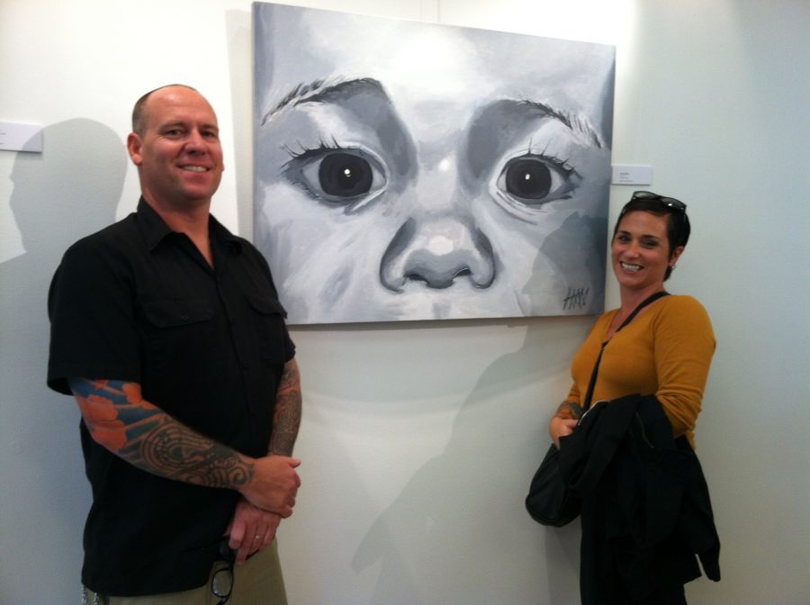 Alex Nelson and his wife, Carissa Nelson standing in front of his piece, “Seth,” at the Art Institute gallery in San Francisco, Spring 2015.