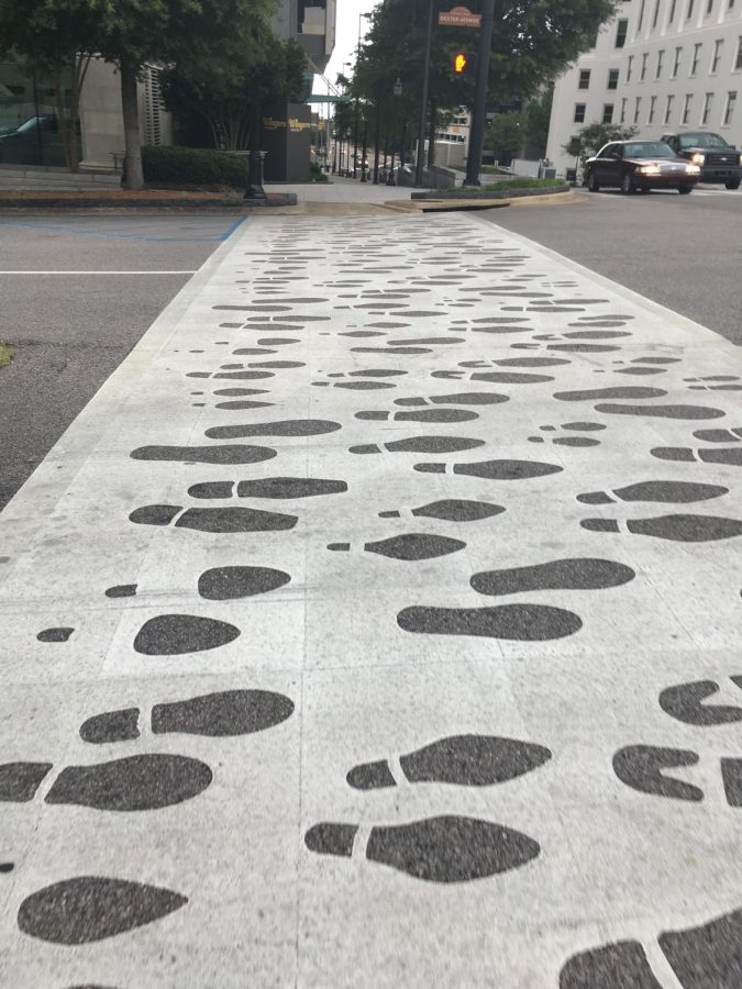 Artwork on a sidewalk in Birmingham, Alabama shows the path traveled by protesters and the journey theyve endured