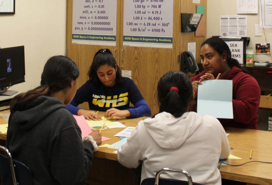 Seniors Harleen Kahlon and Rhea Ramankutty help out druing the take-home project. Photo by Melany Alas.