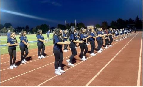 Dance and Cheer as they hype up the football crowd