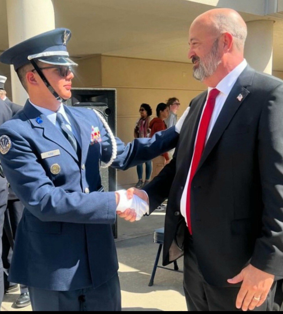 Robert Rickman (Right) And Baktash Azizi (left) shaking hands