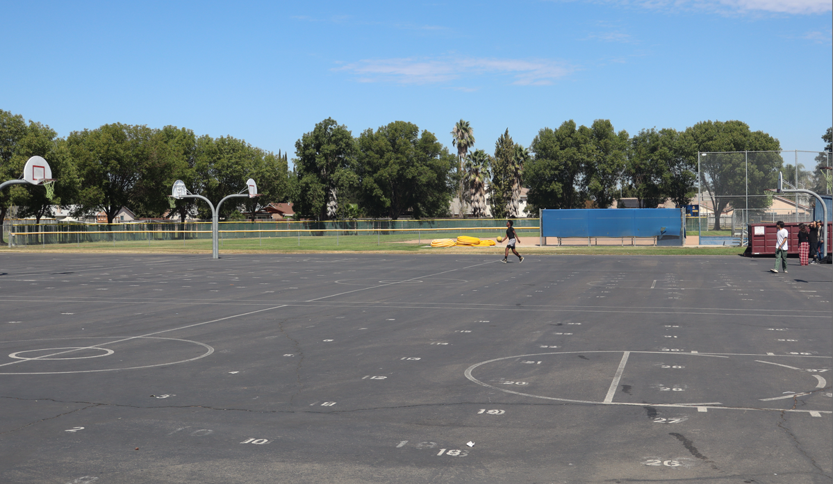 Students play basketball at lunch. 